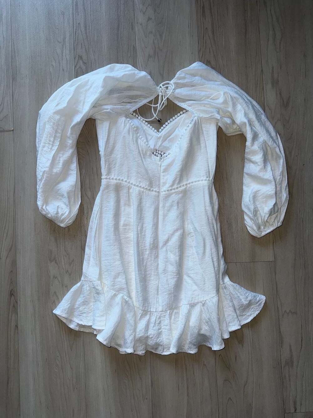 White Long Sleeve Cutout Mini Dress with Pom Pom Trim